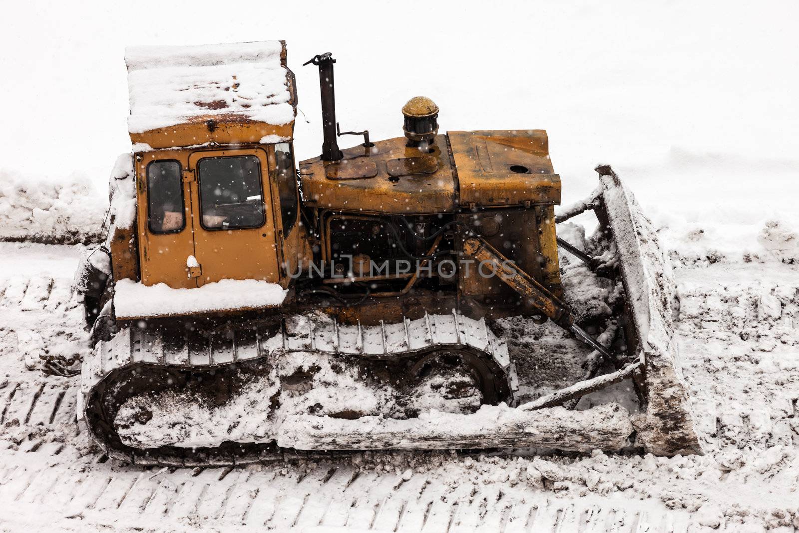 Bulldozer at building construction site by ia_64