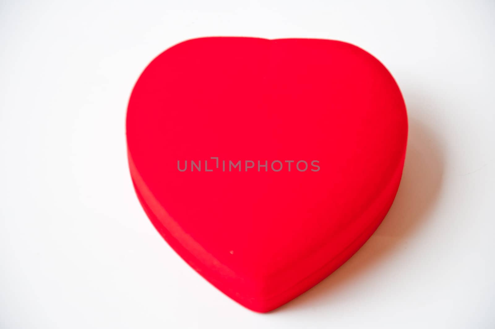 Red heart shape on white background by buffaloboy