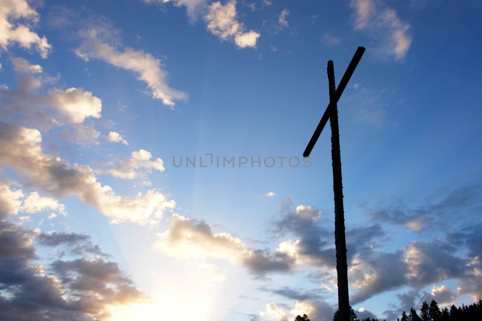 cross with sky and sun in the background cross with sky and sun in the background