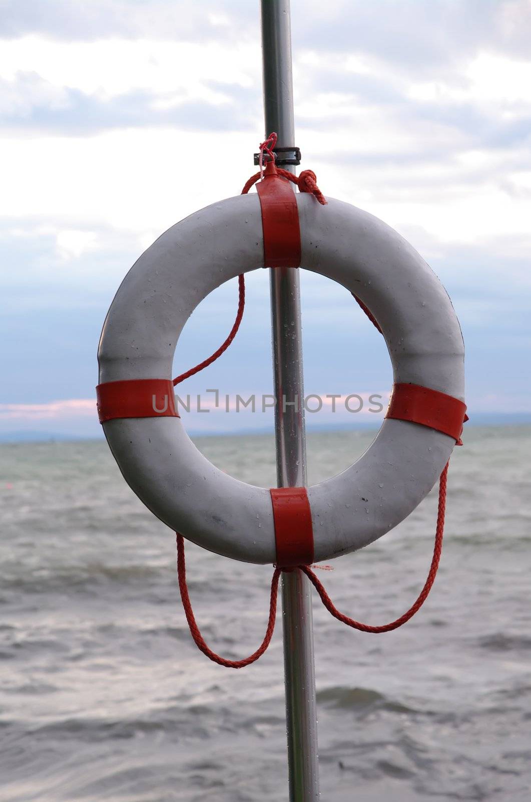 life belt on a stand at a lake