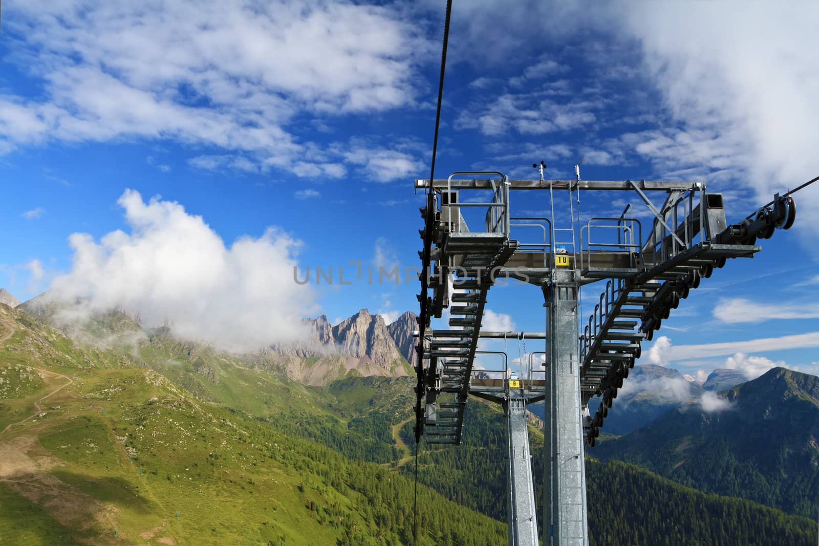	summer landscape of Italian Dolomites with ski lifts on foreground