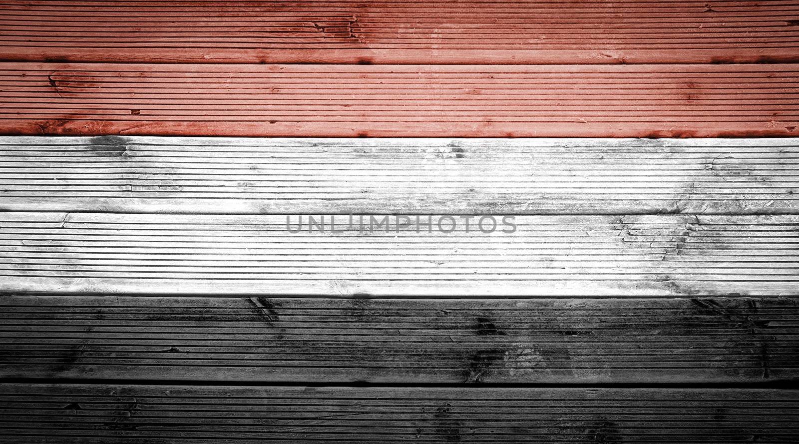 Natural wood planks texture background with the colors of the flag of Egypt