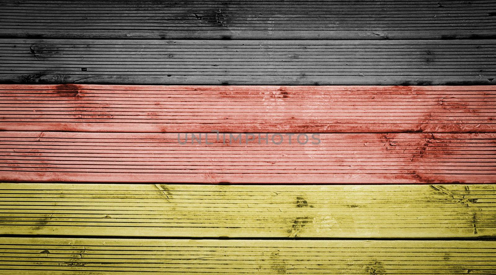 Natural wood planks texture background with the colors of the flag of Germany