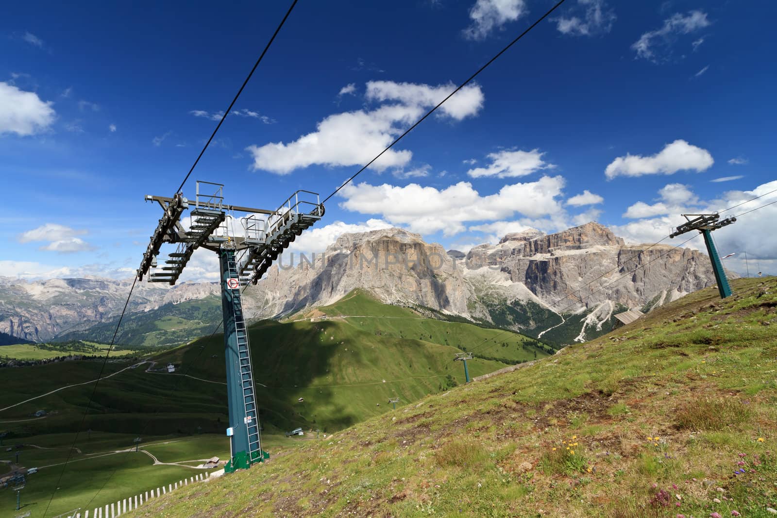 summer landscape of Italian Dolomites with ski lifts on foreground