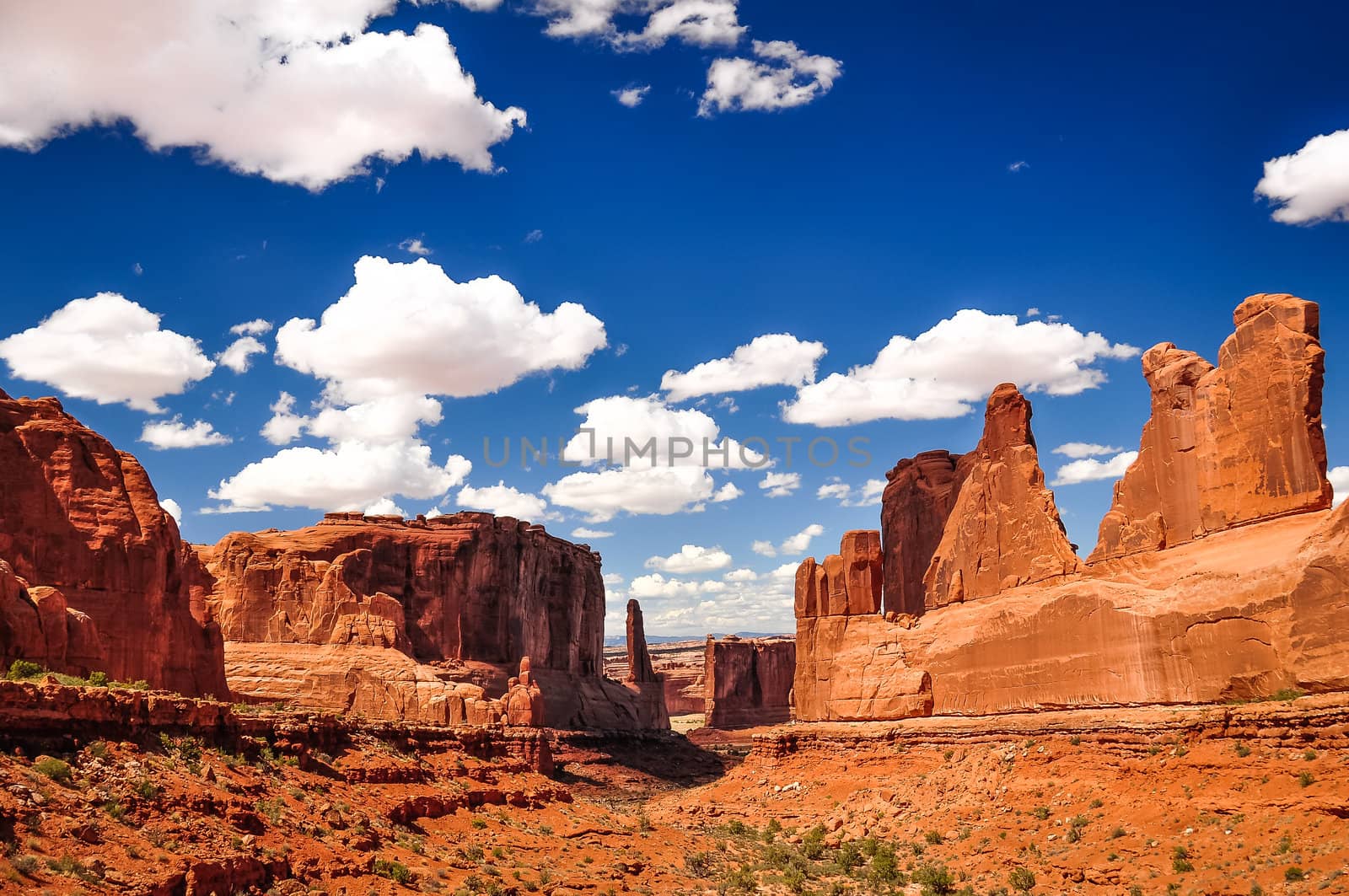 Arches National Park landscape view with blue sky and white clouds, Utah, USA