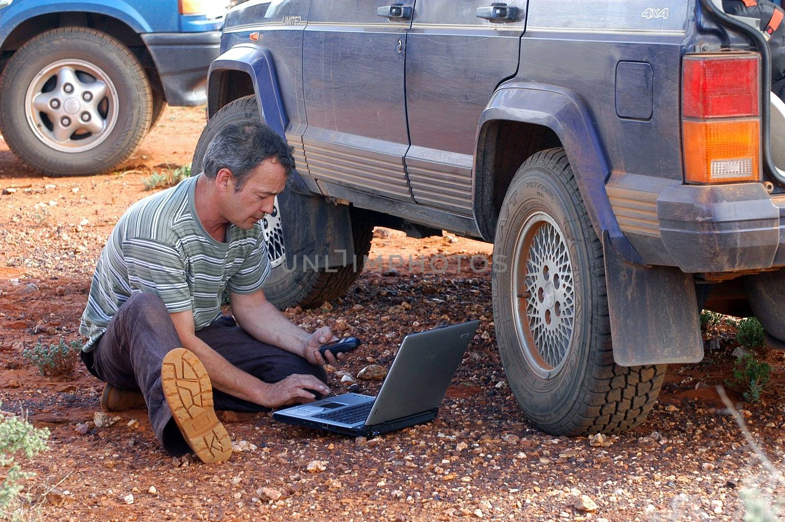 in search of the good road in the Australian bush using a gps connected to a laptop.