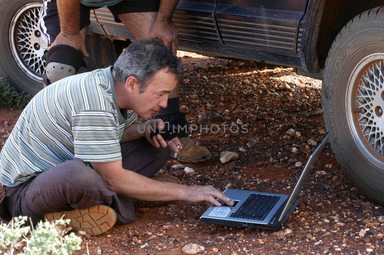 in search of the good road in the Australian bush using a gps connected to a laptop.