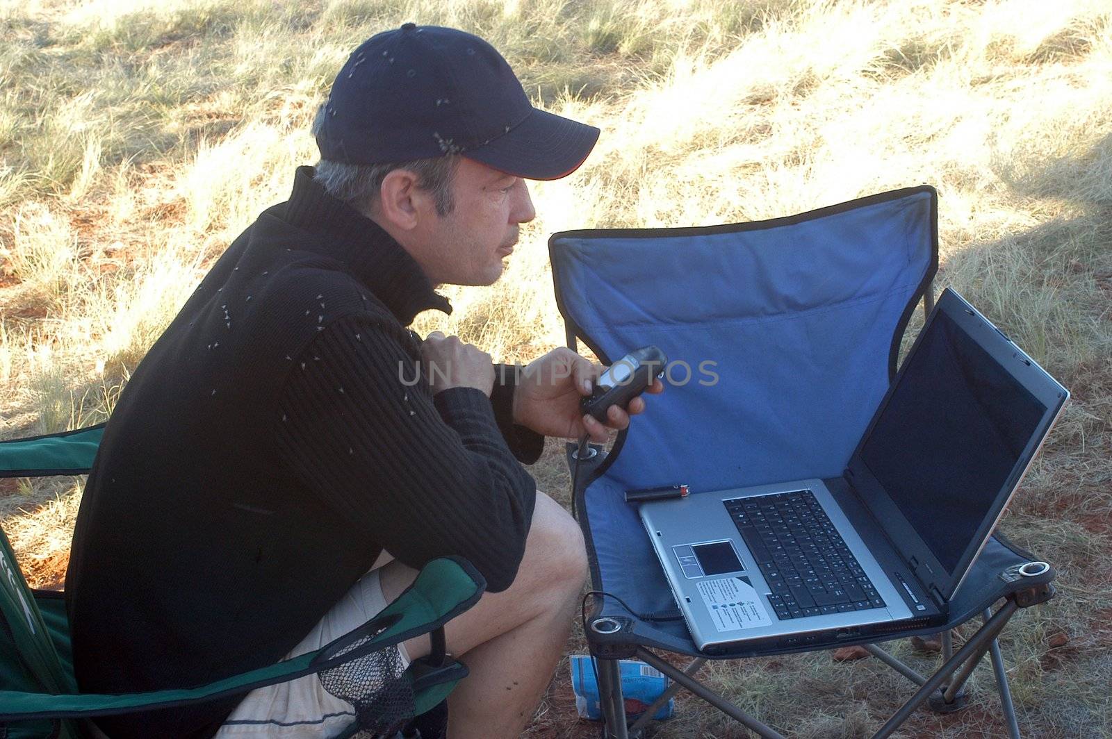 technology in the Australian bush, the treatment of the photographs and information of the day on computer
