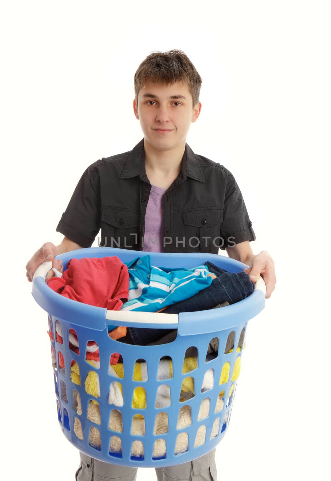 Teenager holding a blue laundry basket 