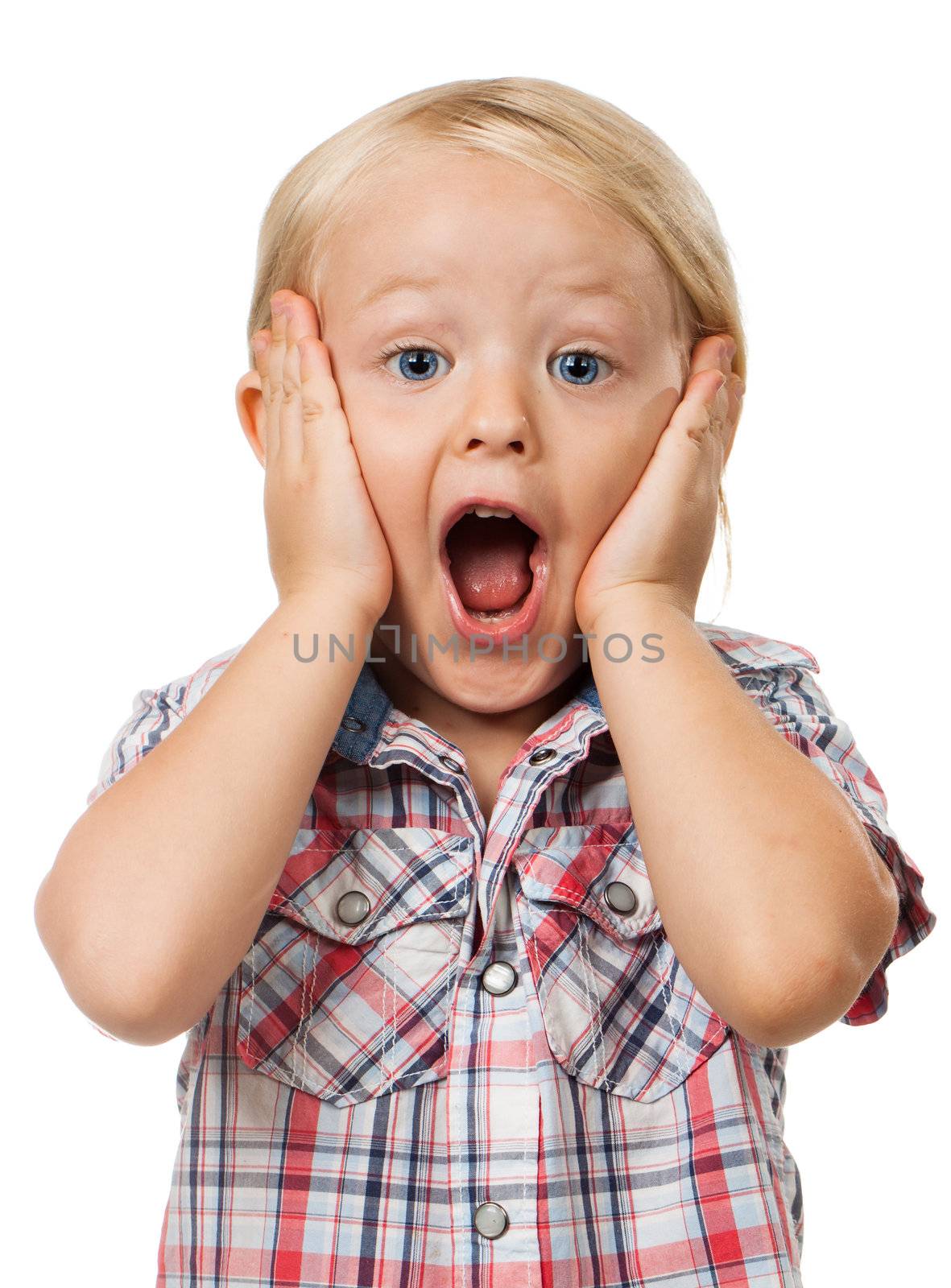 A very cute young surprised boy looking at camera, Isolated on white.