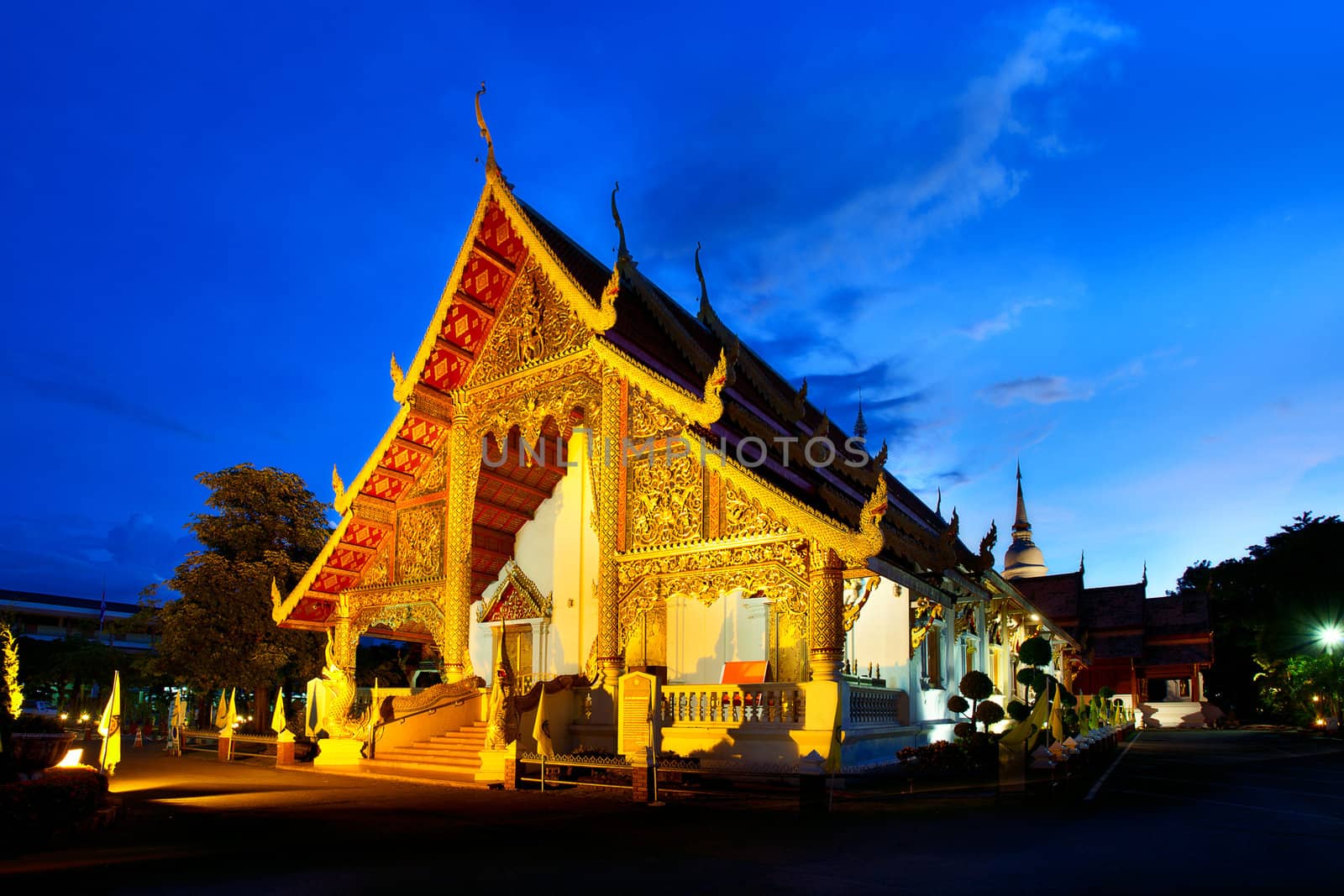Wat Phra Singh temple at sunset in Chiang Mai, Thailand. 