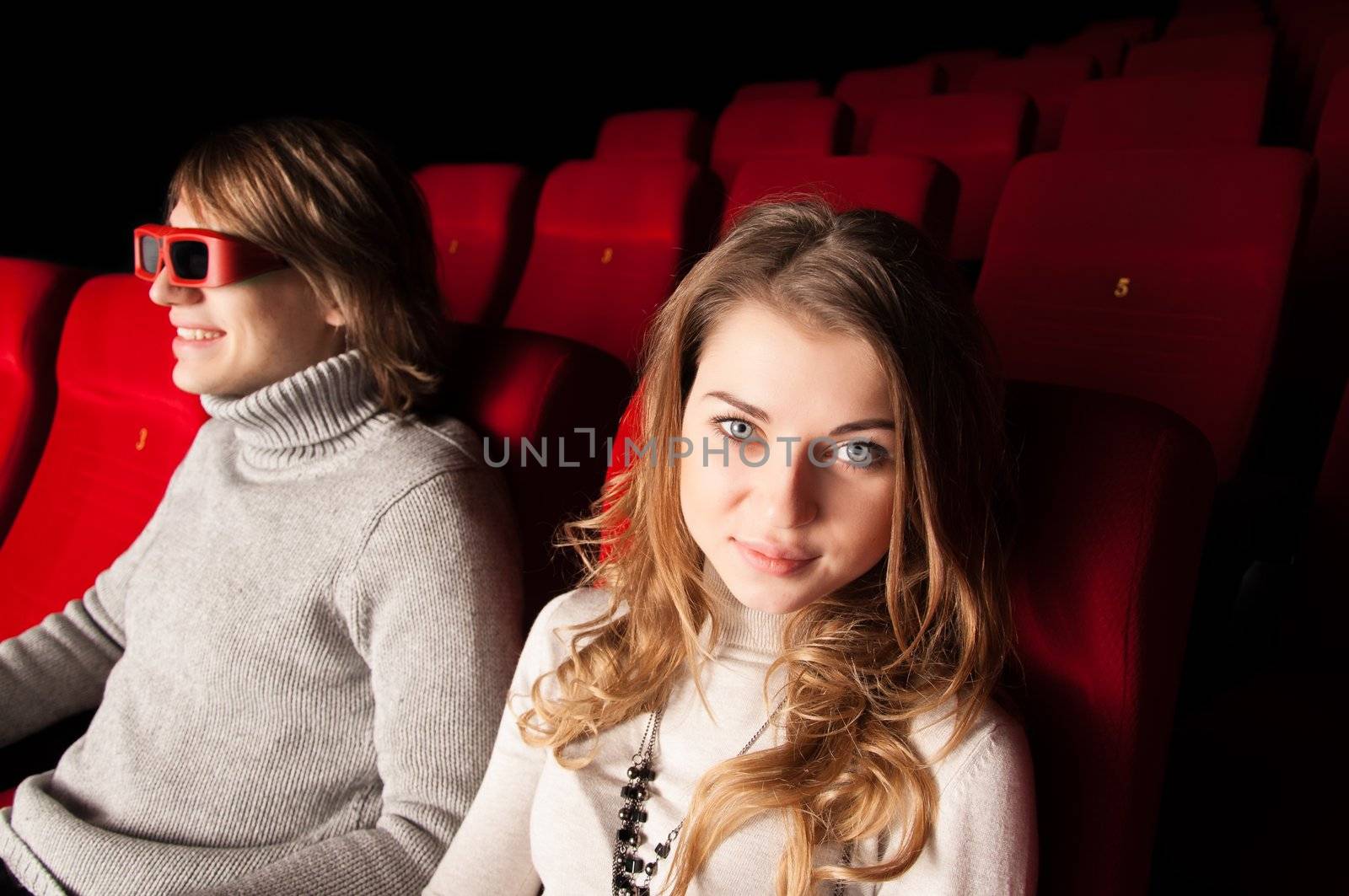 young couple in the cinema to enjoy the movie