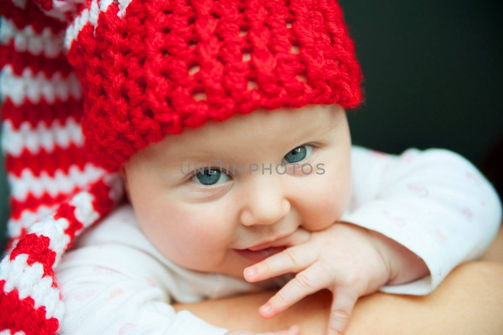 child of tender years in red hat