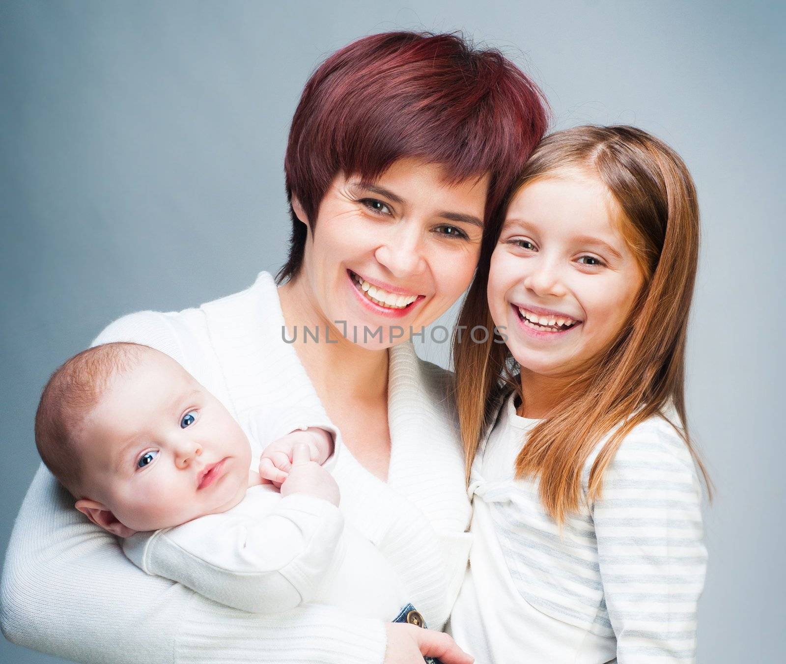 Smiling mother with her cute kids