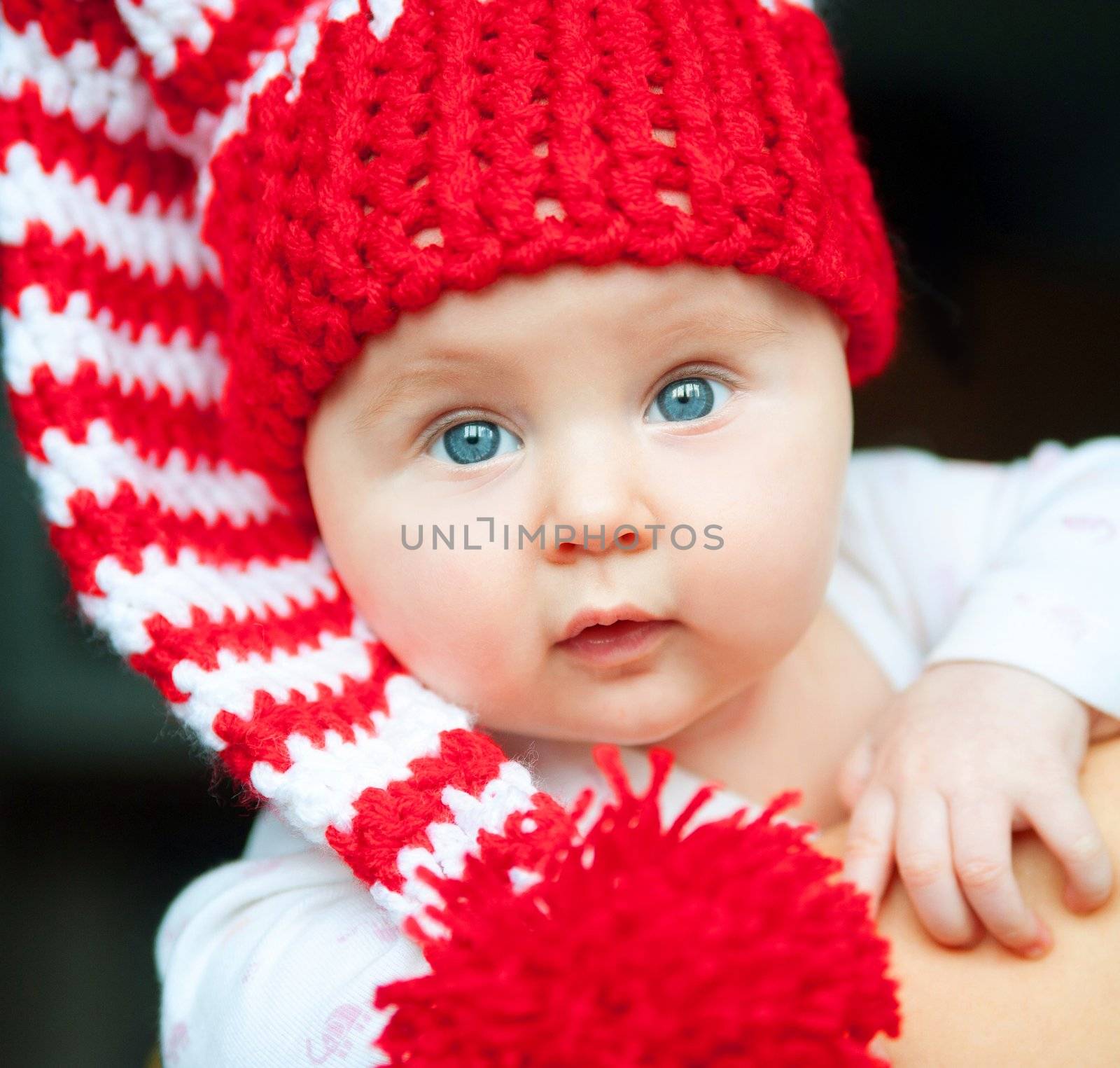 pretty infant in red hat