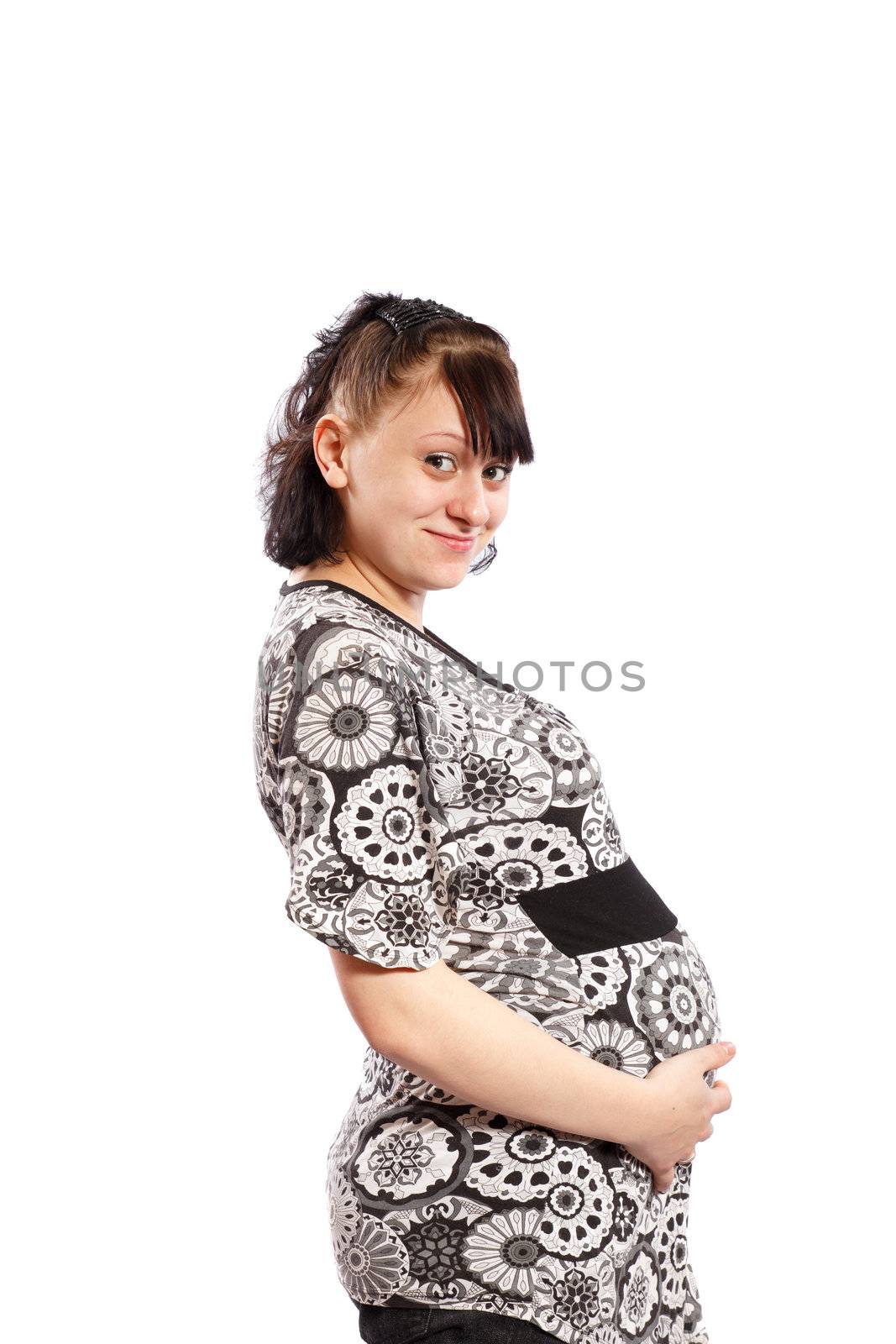 Pregnant woman touching here belly on white background