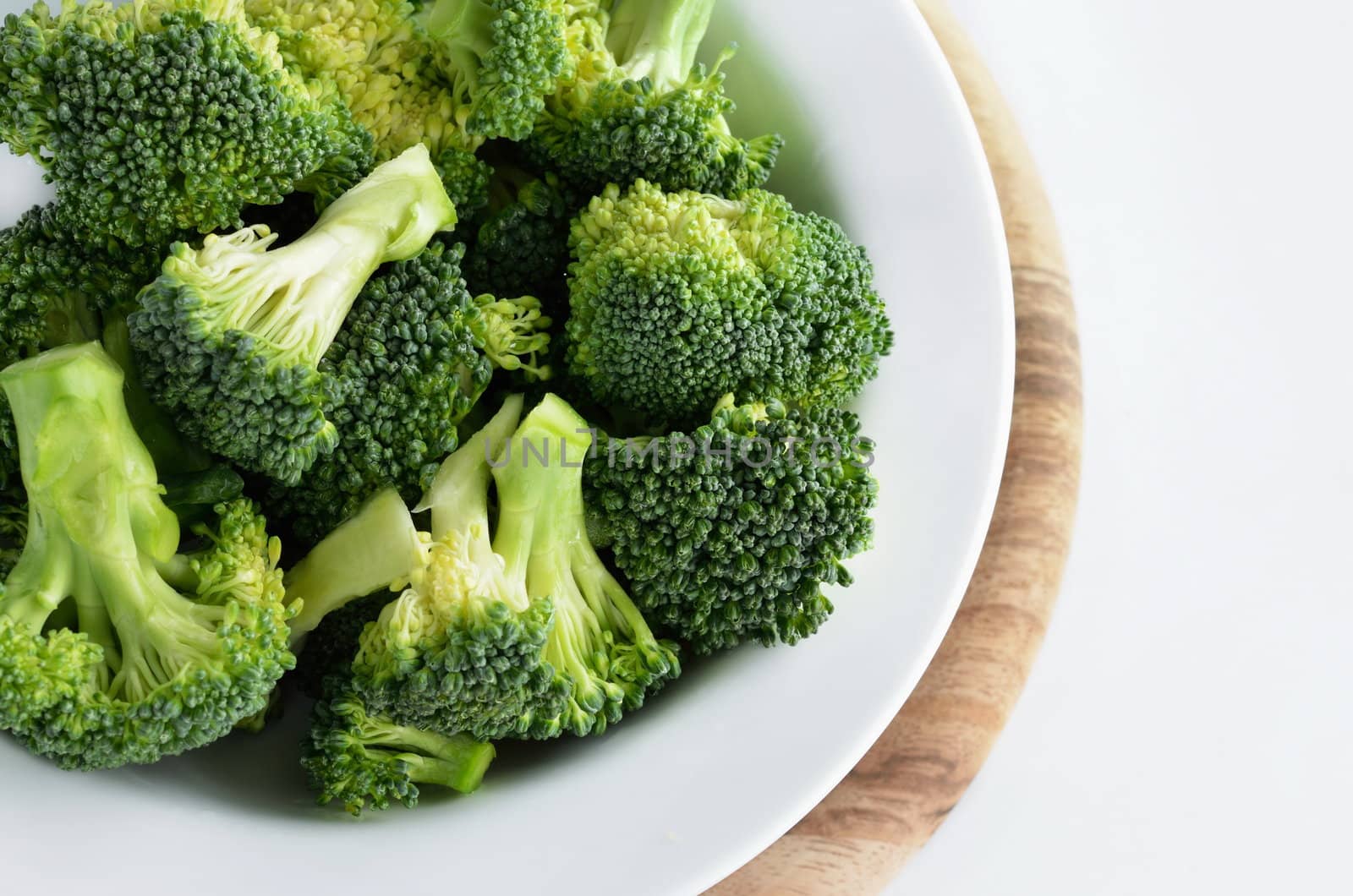 Broccoli vegetable in dish  isolated on white