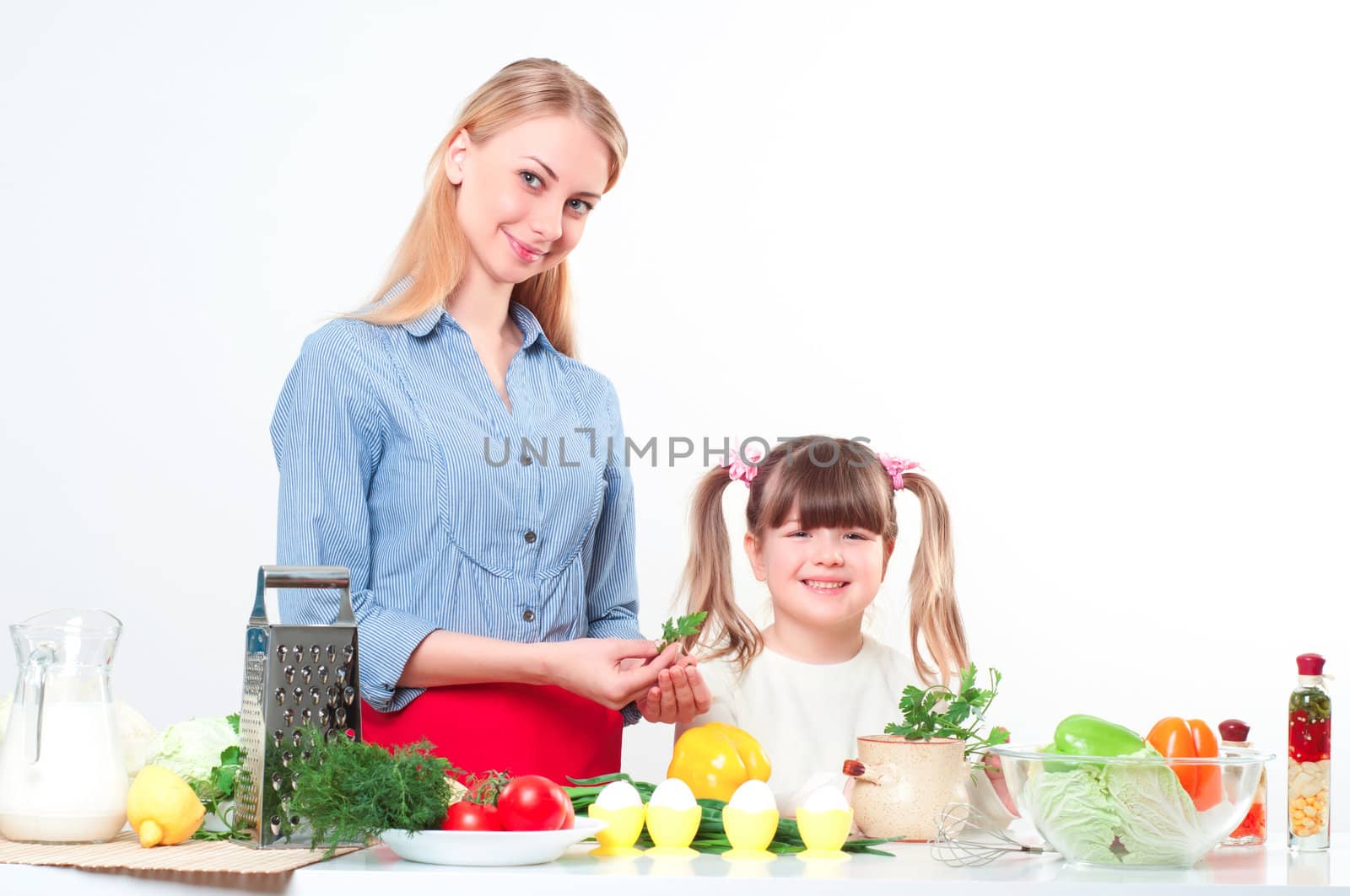 Mother and daughter cooking together, help children to parents