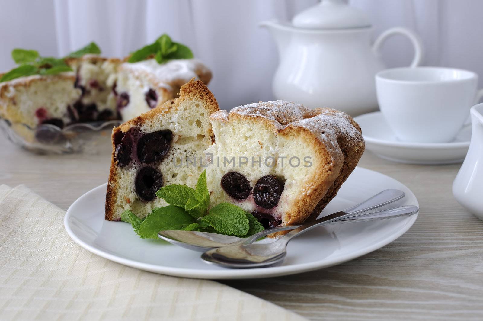 Pieces of soft sponge cake with cherries