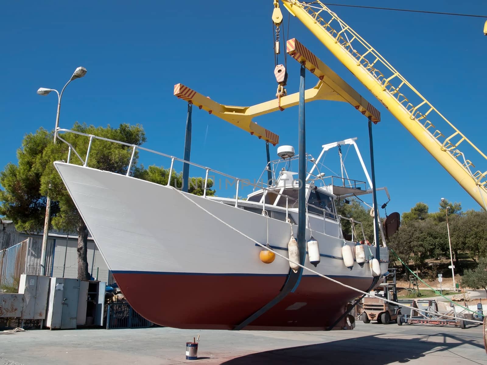 fishing boat after repair on crane