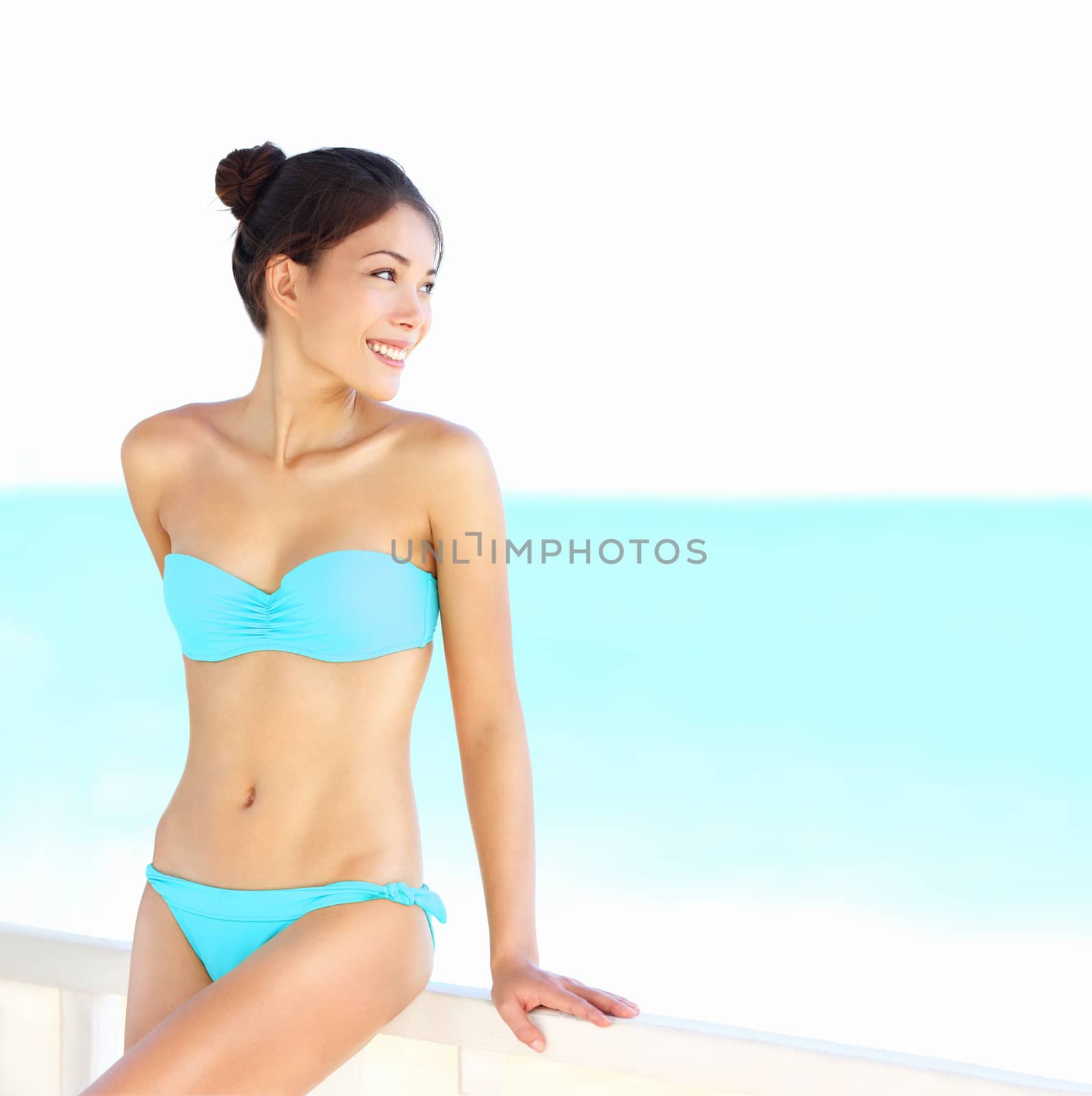 Beach bikini woman beauty on summer holidays vacation. Beautiful mixed race Asian Chinese / Caucasian woman looking at ocean in Varadero, Cuba, Caribbean.