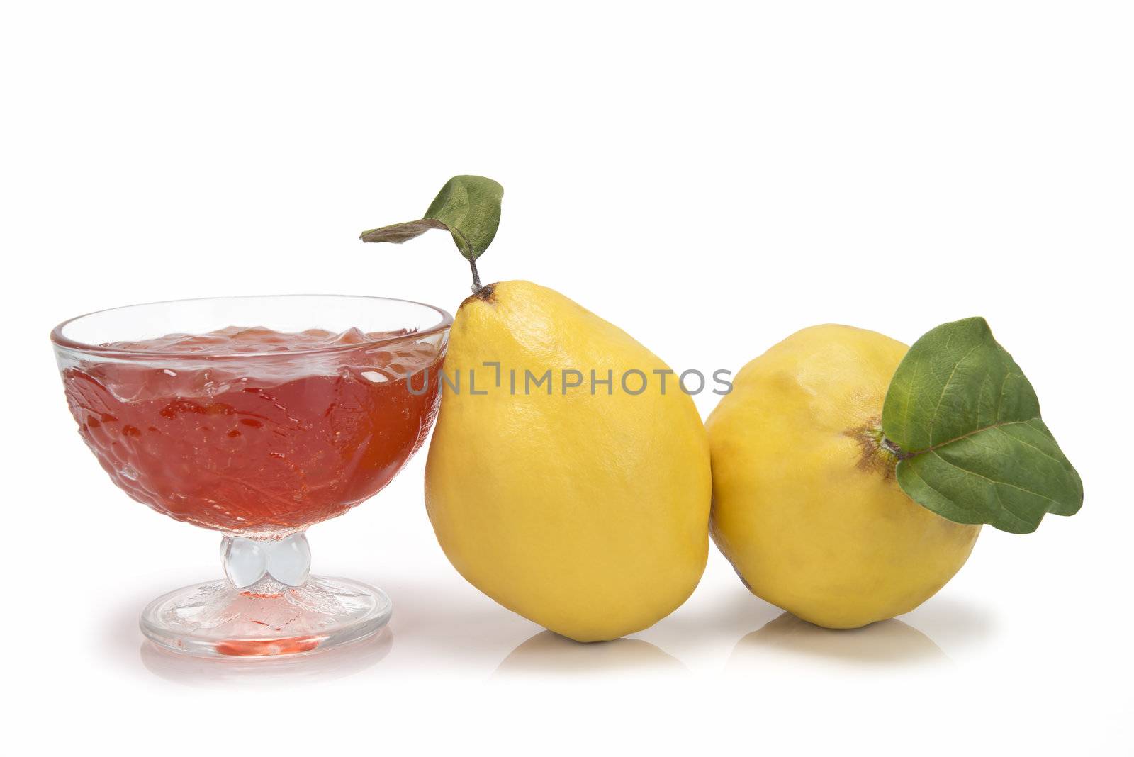 Still life with quinces and quince jelly in a glass cup