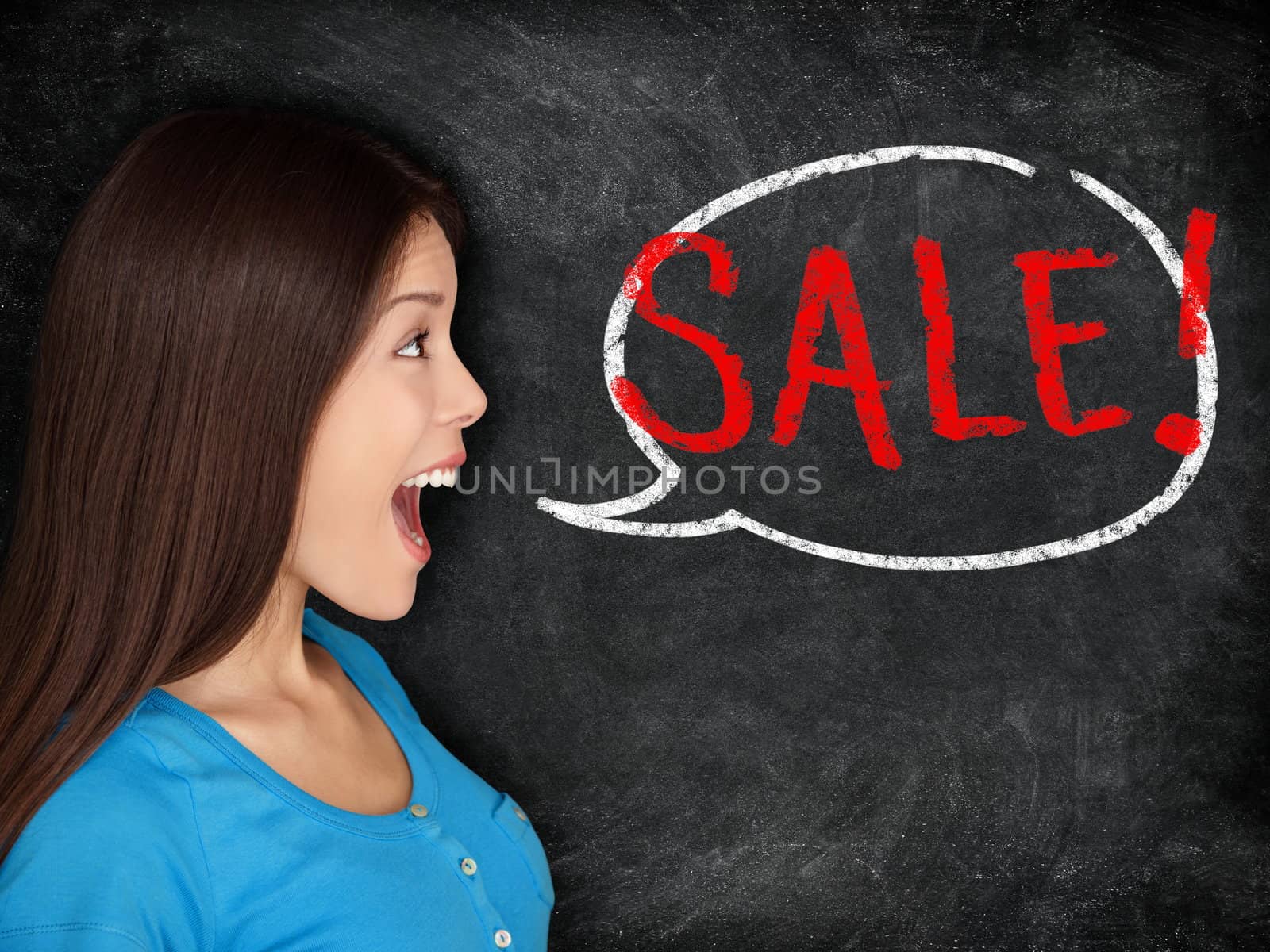 Sale blackboard woman concept. Young woman saying SALE in speech bubble on blackboard background texture. Beautiful mixed race shopper excited.