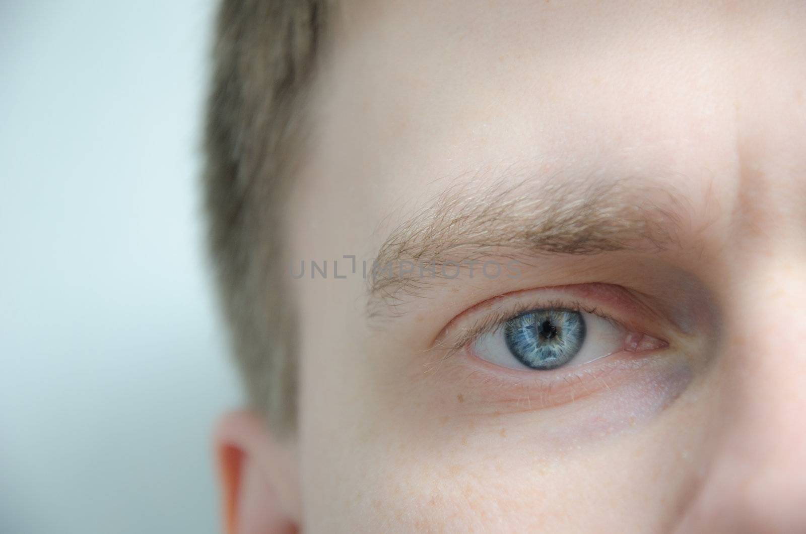 Eye of a young man looking ahead