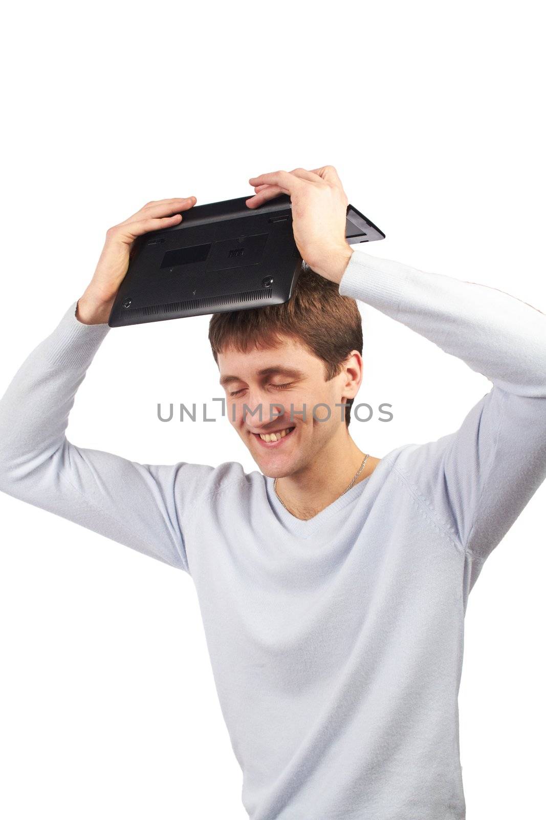young man holding a laptop above head by tigrek