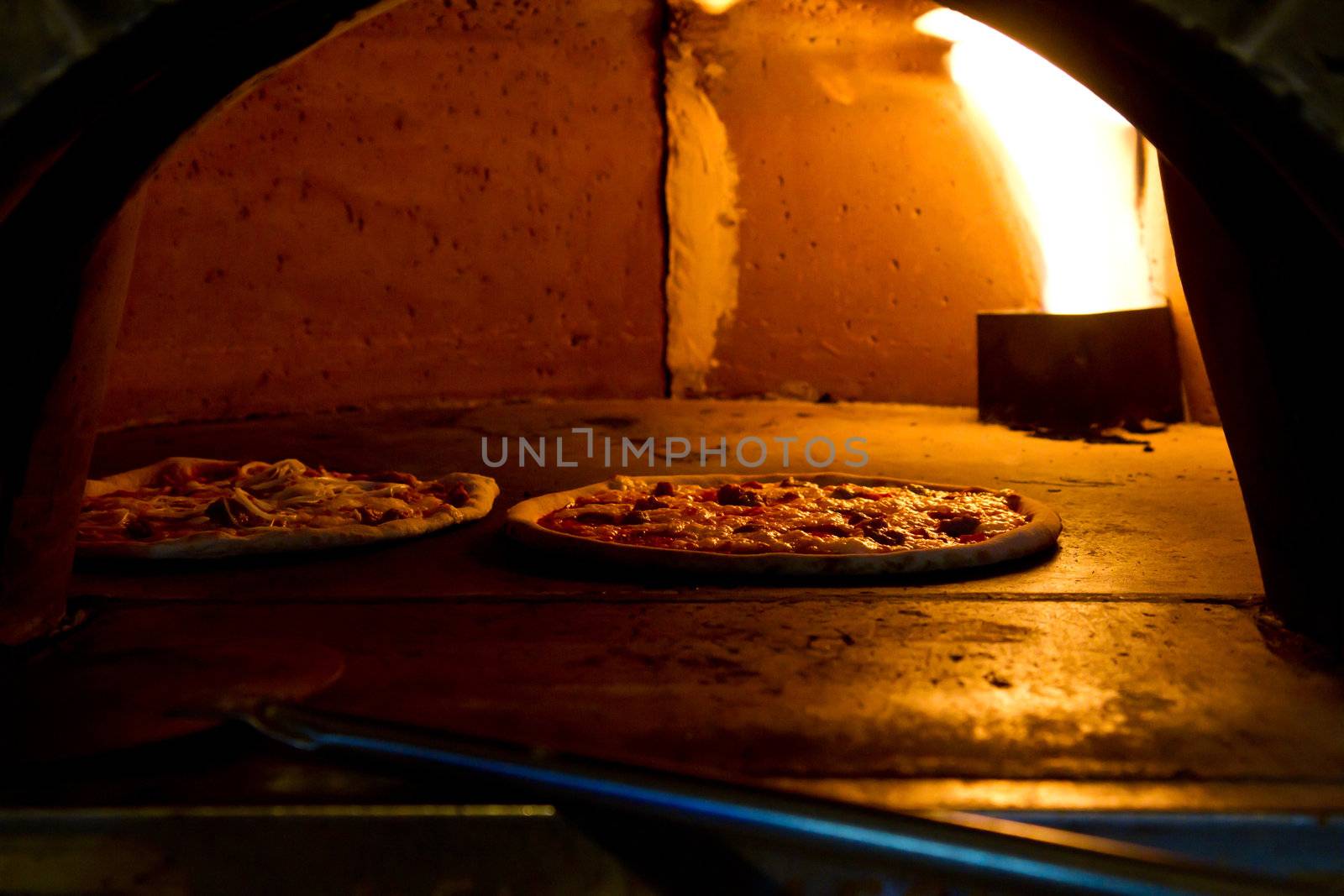 Pizza baking in the oven by lsantilli