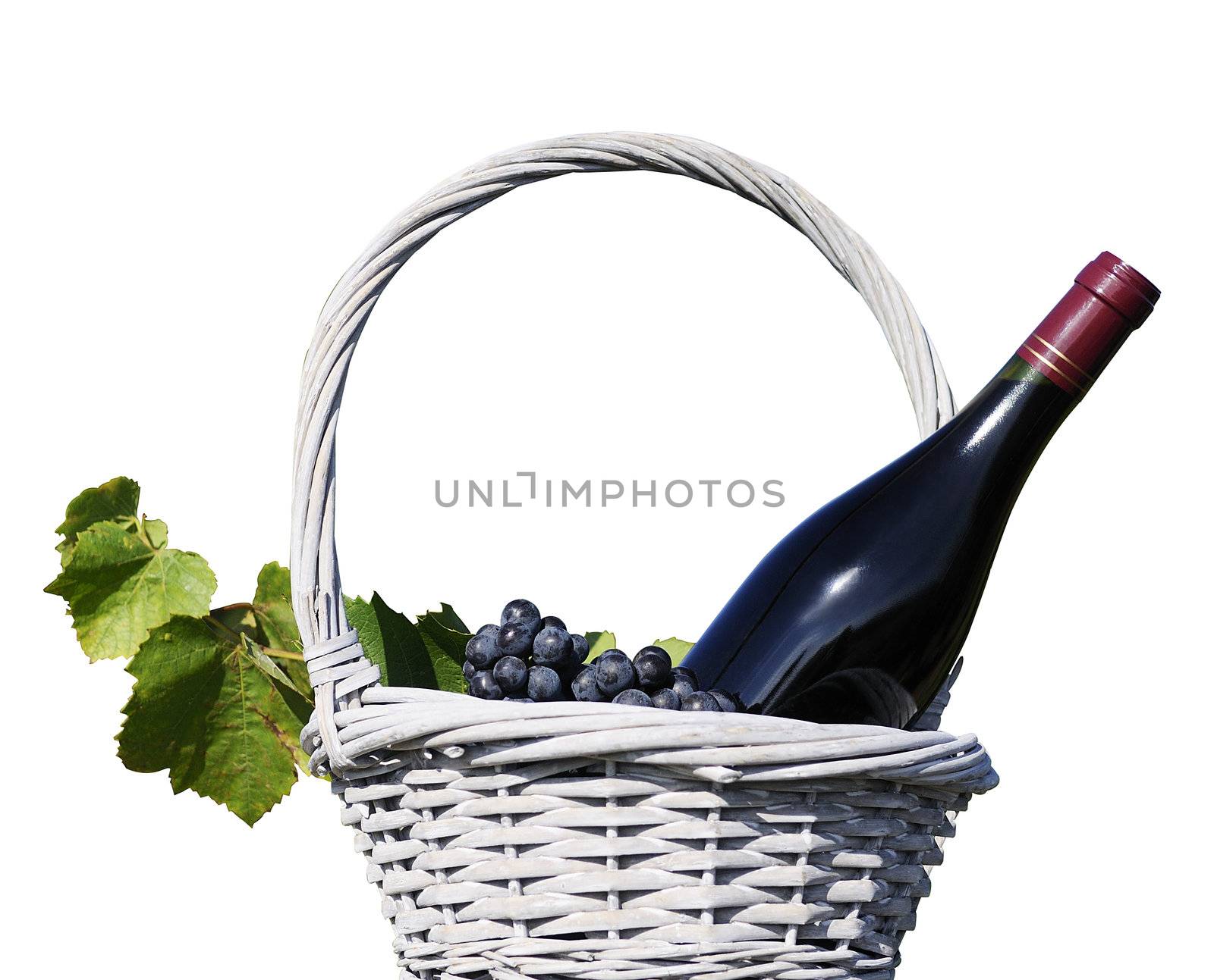 image shows a bottle of red wine in a traditional basket with grapes