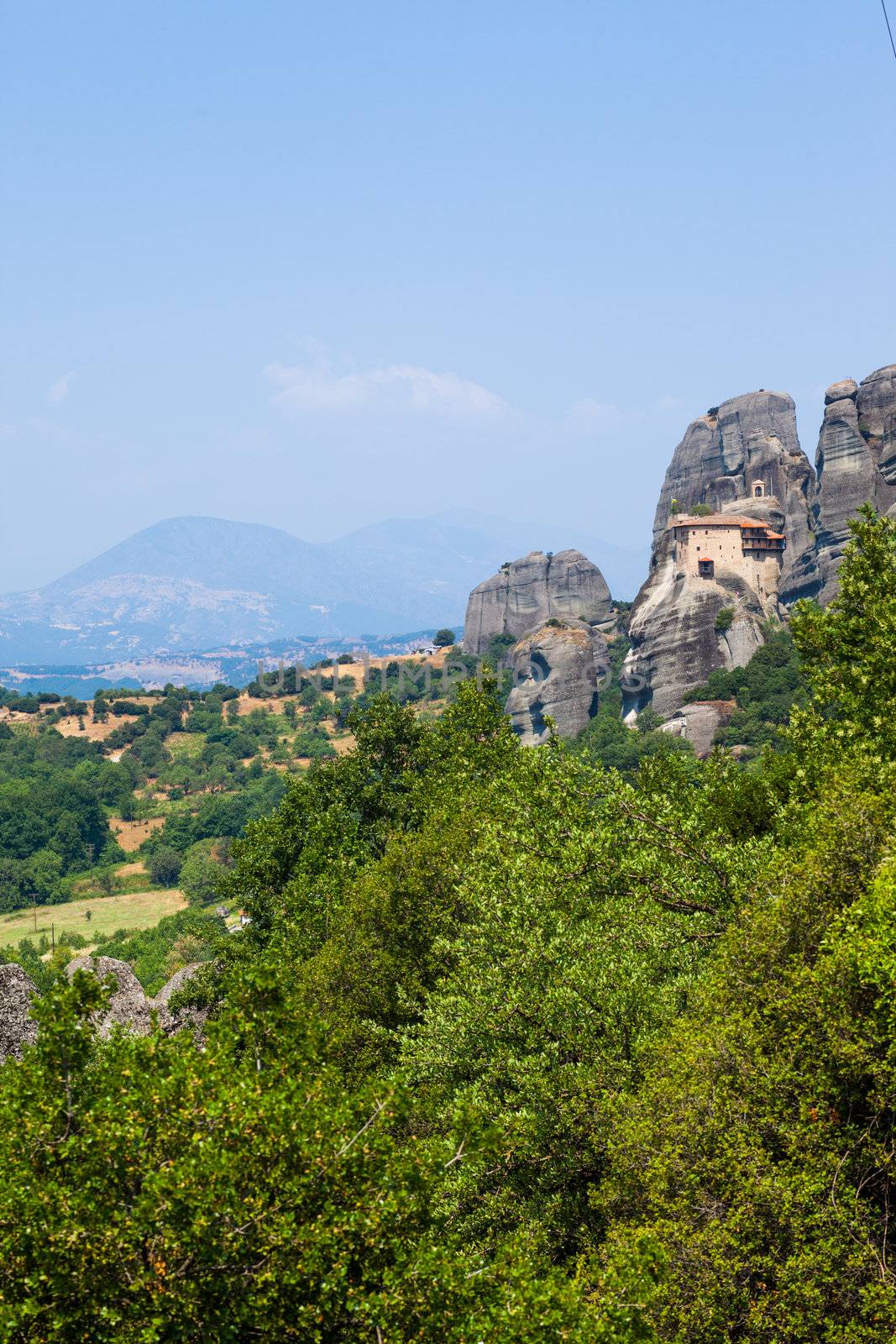 Meteora. Famous Greek Christian monastery on the rock. Greece. Vertical view.