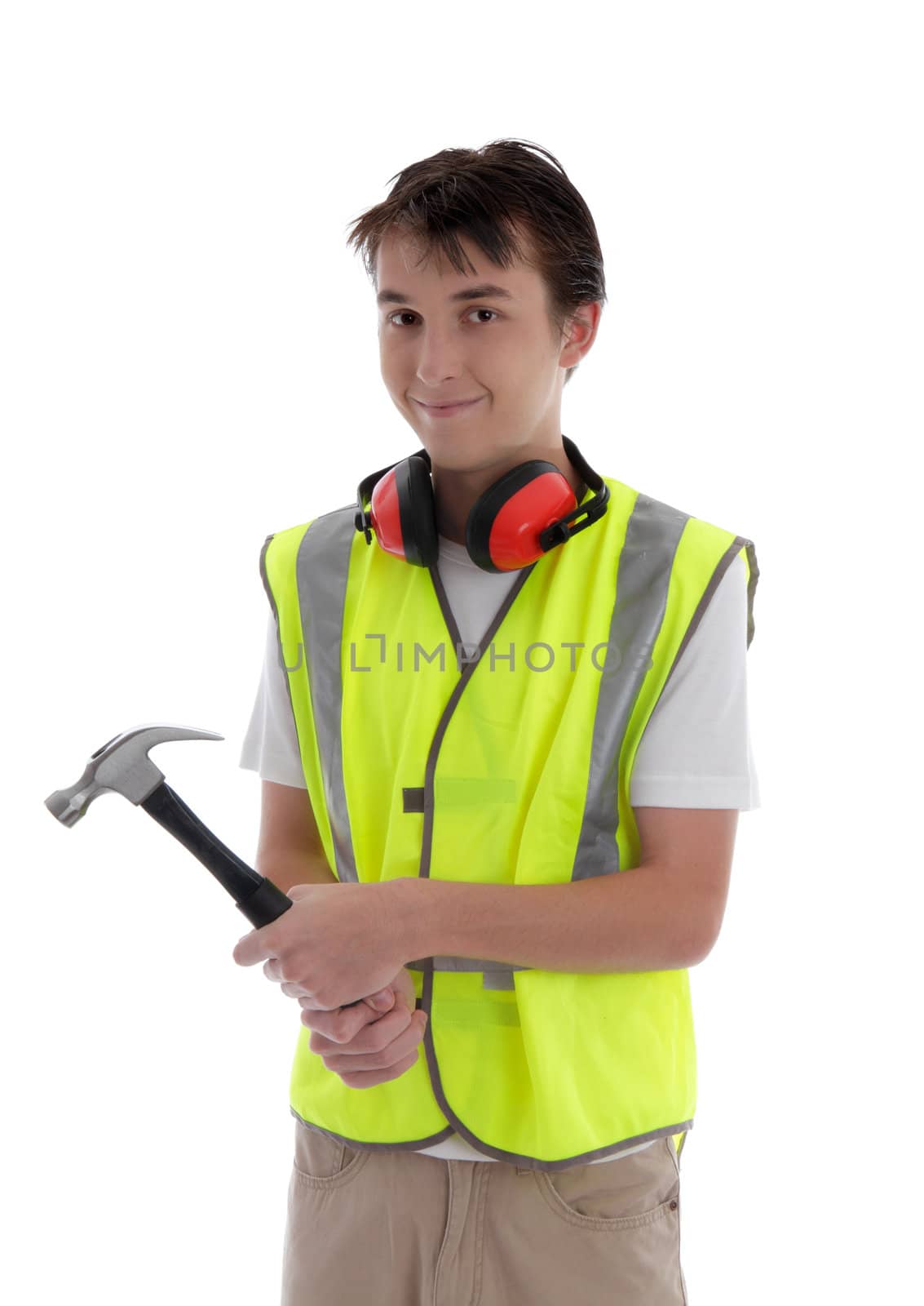 Teenager holding a hammer and smiling.  White background.
