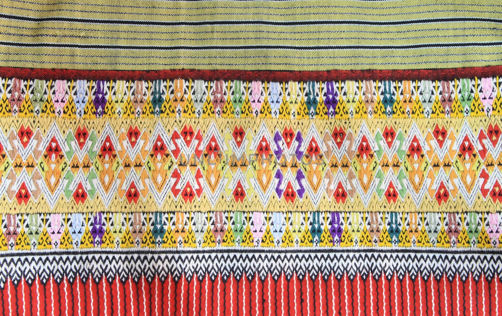 Closeup texture of thai style fabric weave hand-woven   by rufous