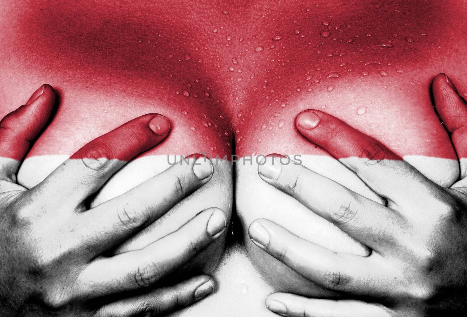 Sweaty upper part of female body, hands covering breasts, flag of Indonesia