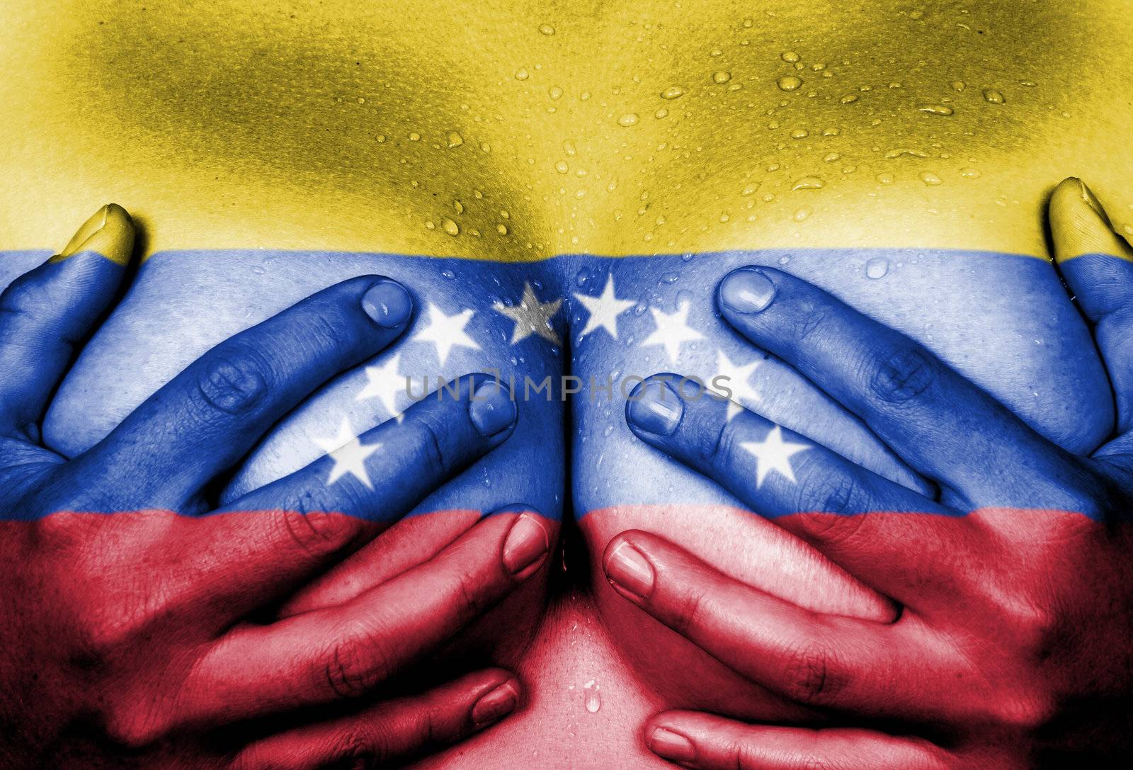 Sweaty upper part of female body, hands covering breasts, flag of Venezuela
