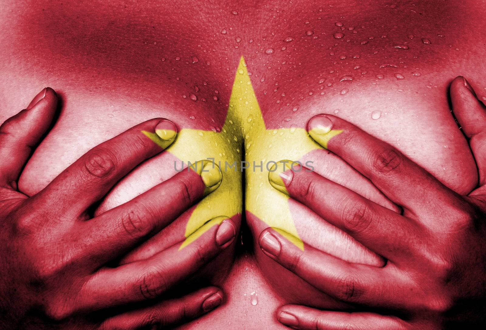 Sweaty upper part of female body, hands covering breasts, flag of Vietnam