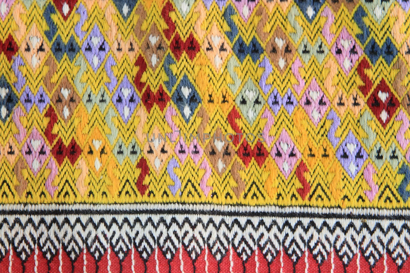 Closeup texture of thai style fabric weave hand-woven   by rufous