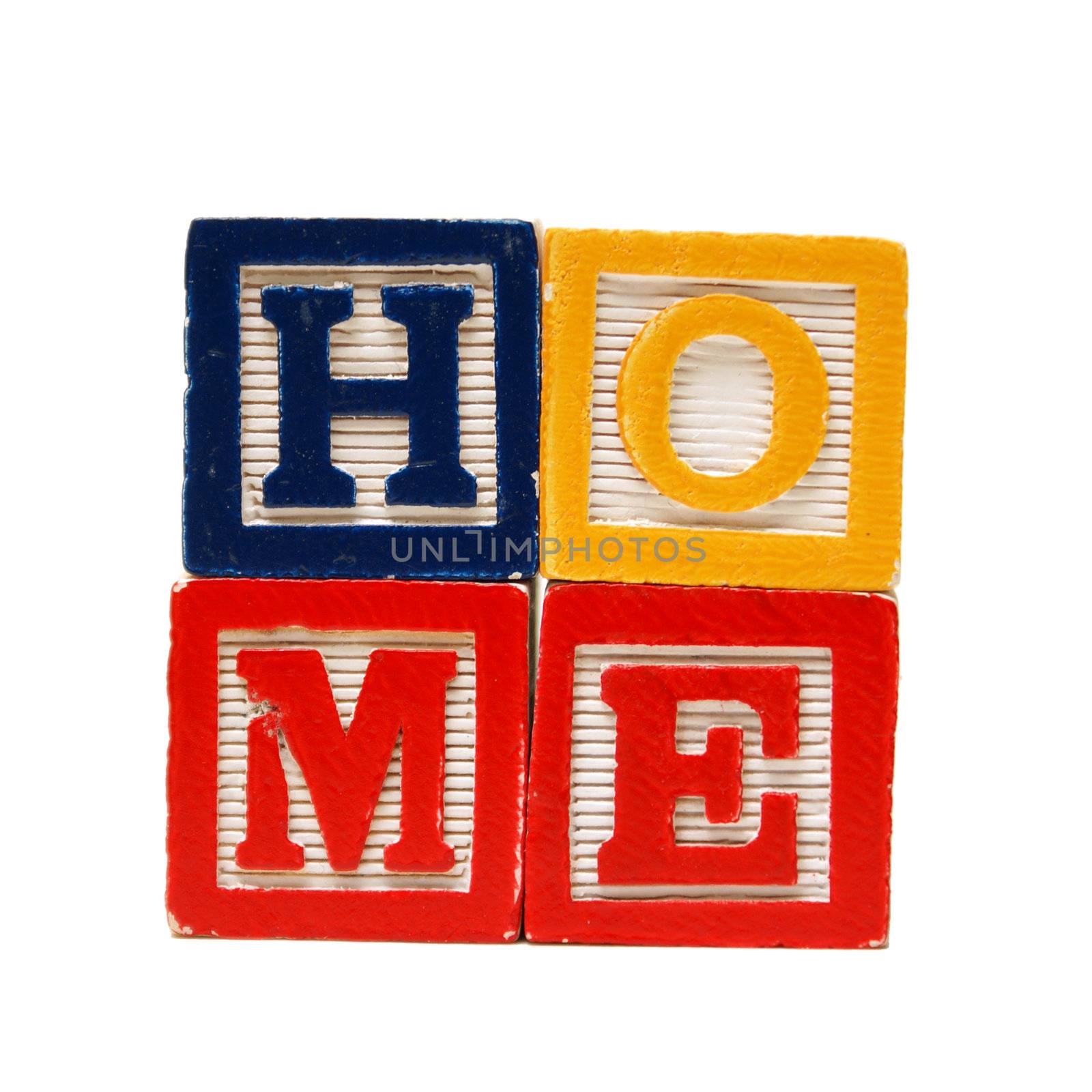 The spelling of the word home using alphabet blocks.