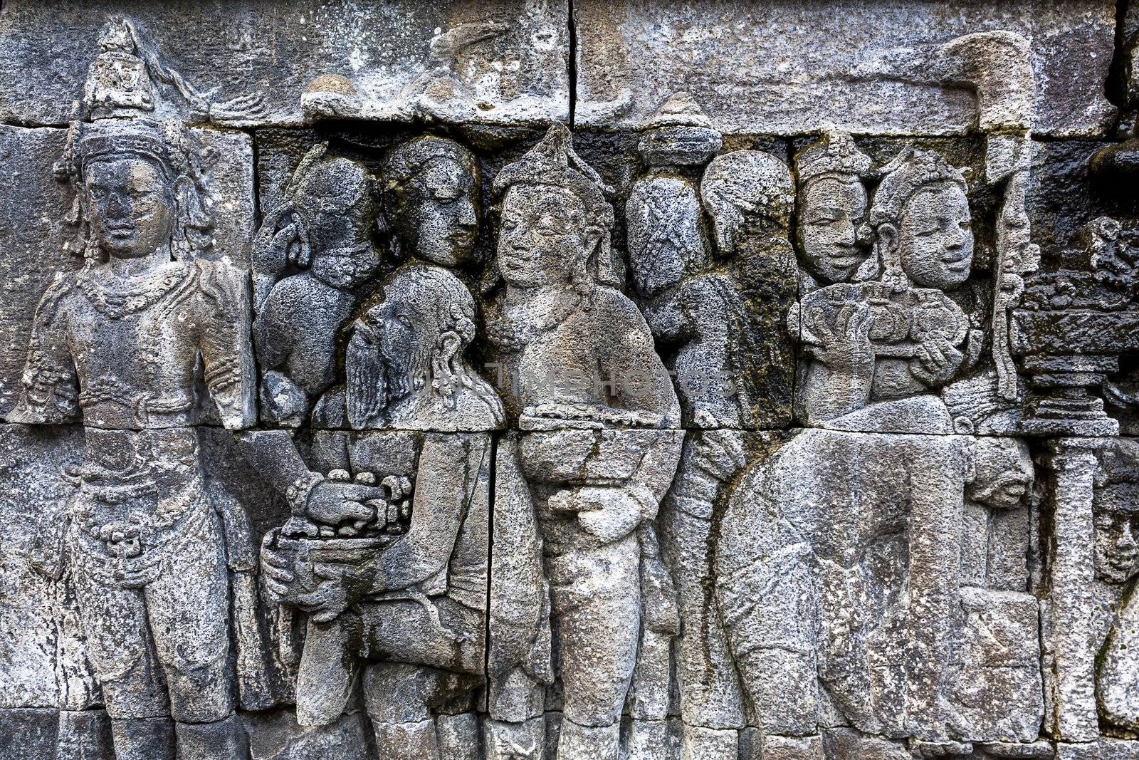 Carved stone at Borobudur temple by jukurae