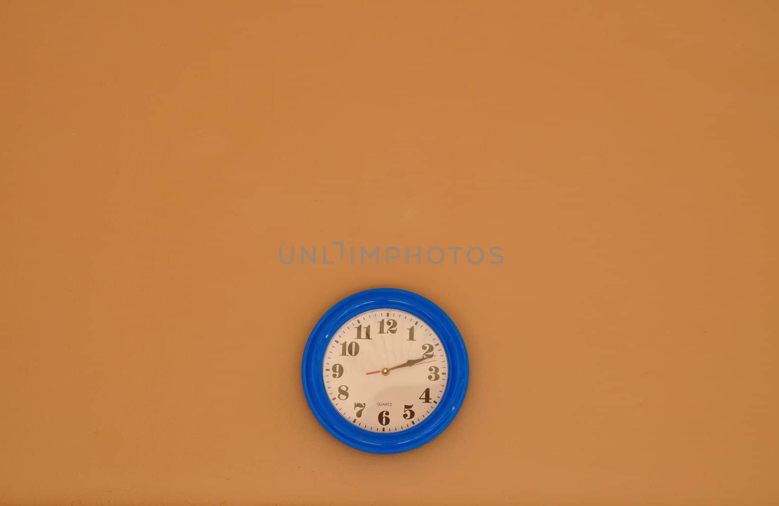 Blue and White Clock on brown Wall by thampapon