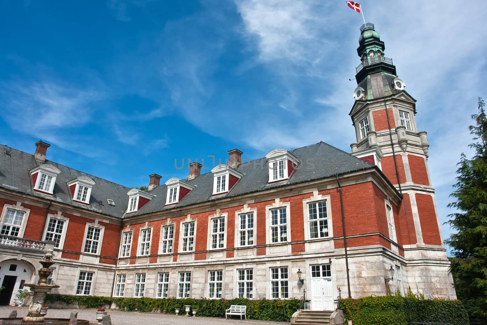 Hvedholm castle slot landmark fairy tale castle in Funen Denmark view of the main building