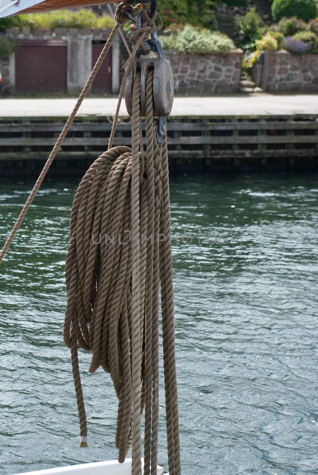 Nautical ropes and pulley on a sail boat by Ronyzmbow