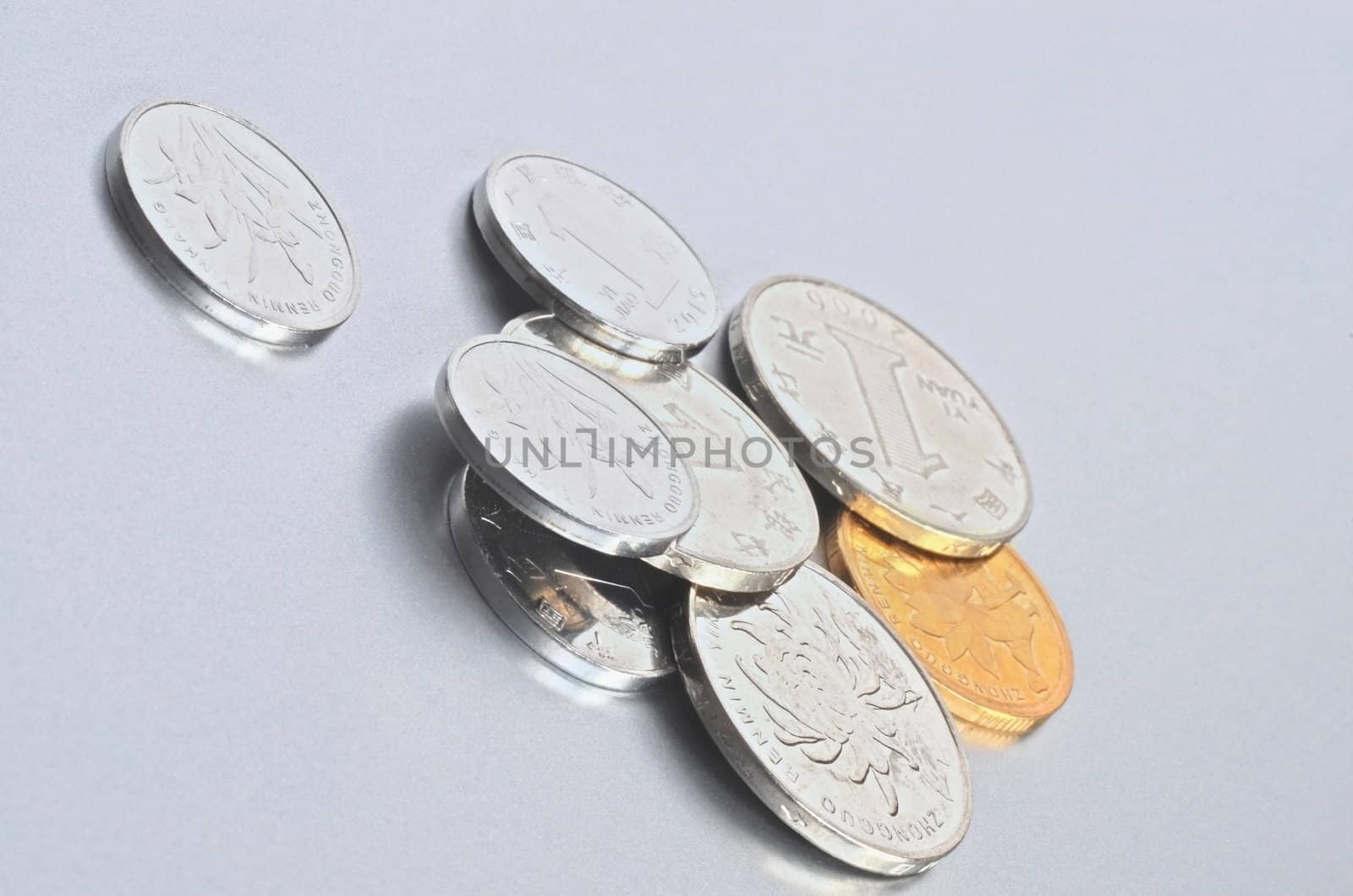 Chinese yuan coins on silver background
