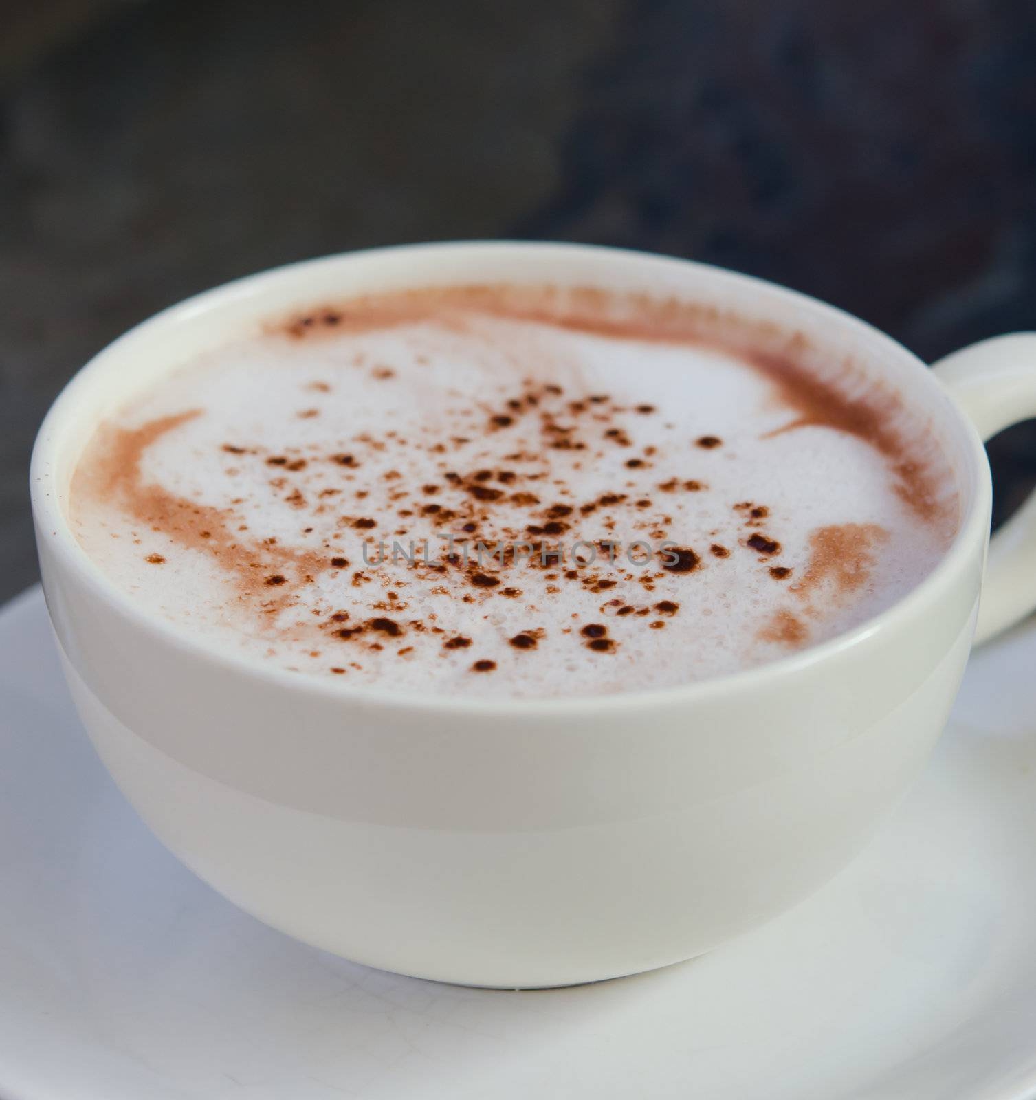 close up hot cappuccino  in white coffee cup