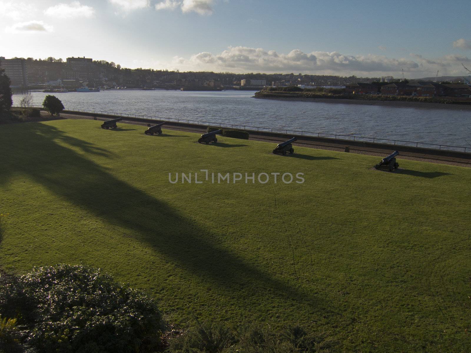 A row of cannons on the bank of the river Medway