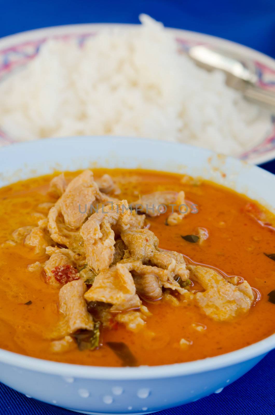  pork in ground peanut-coconut cream curry served with rice