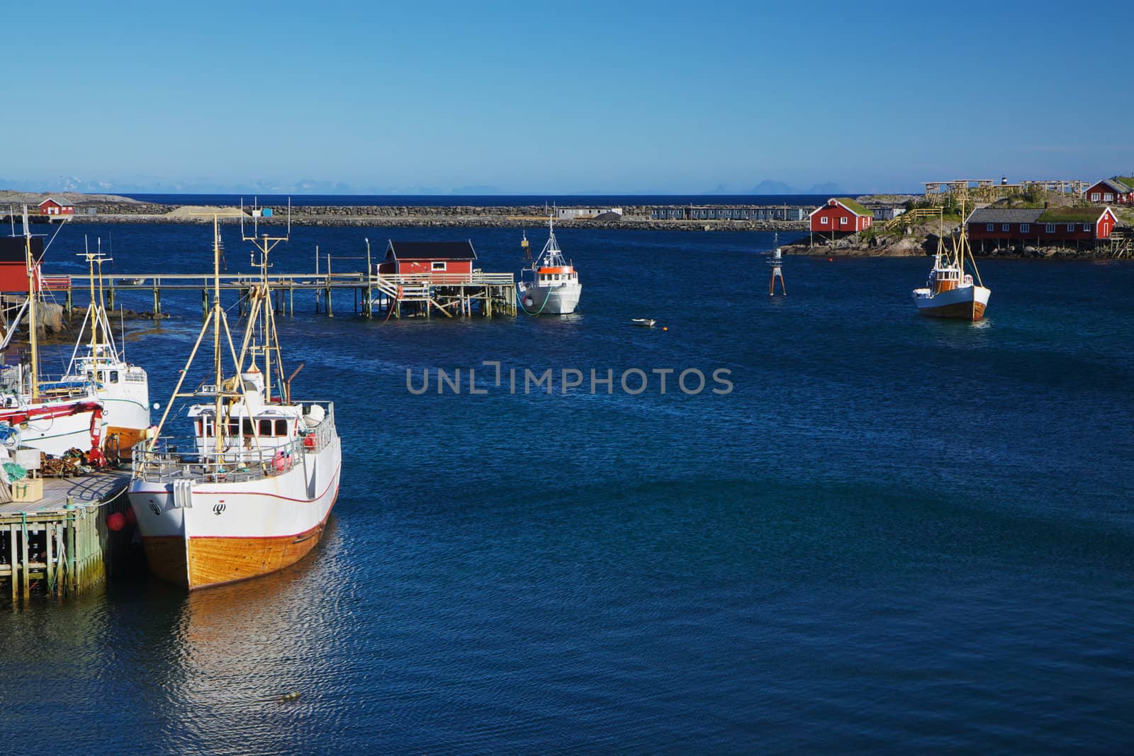 Traditional norwegian fishing boats in town of Reine on Lofoten islands