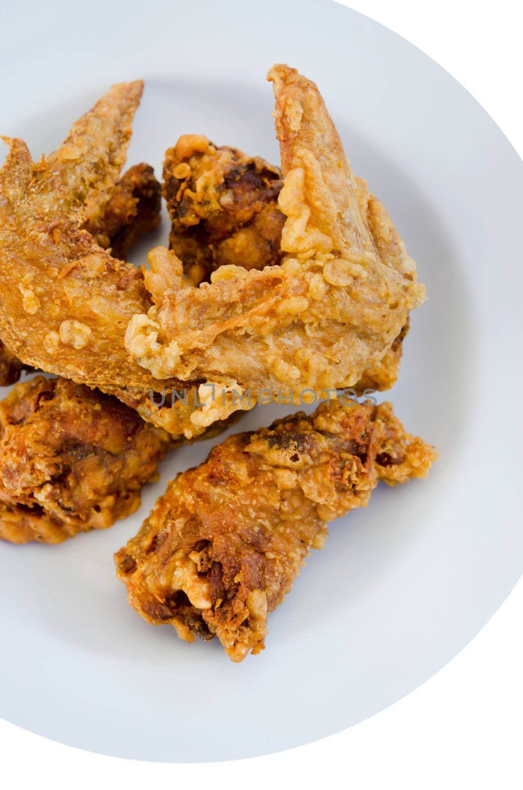 top view deep fried  chicken  on dish , white background