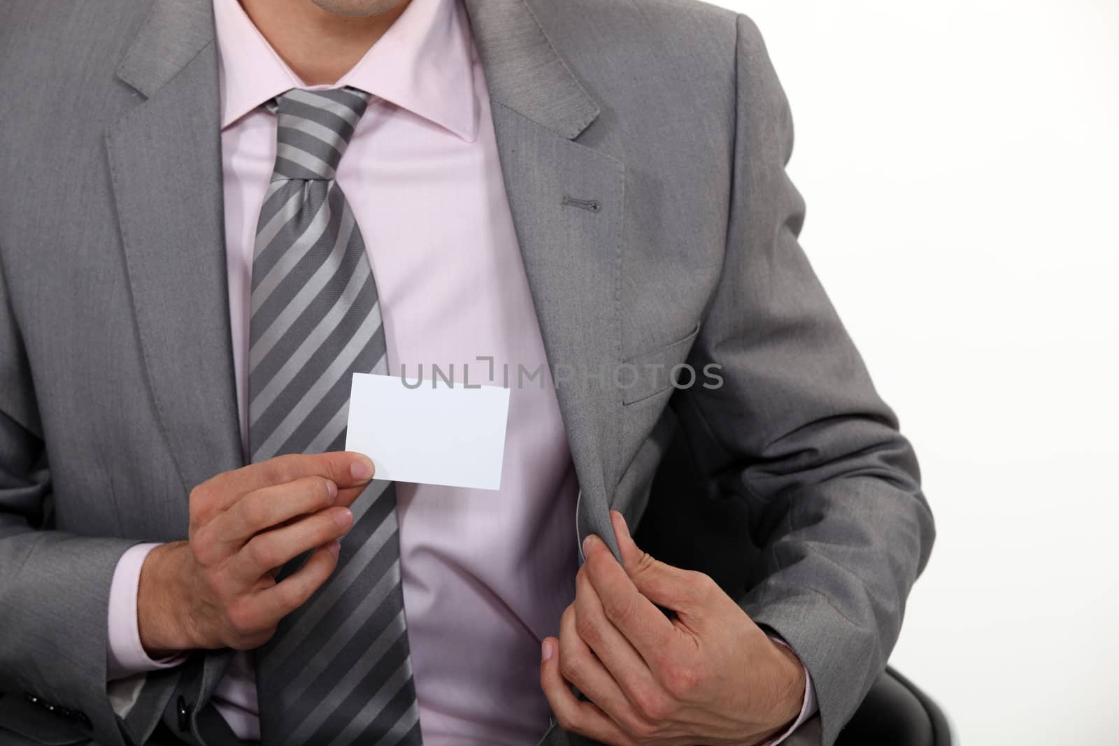 businessman showing business card by phovoir